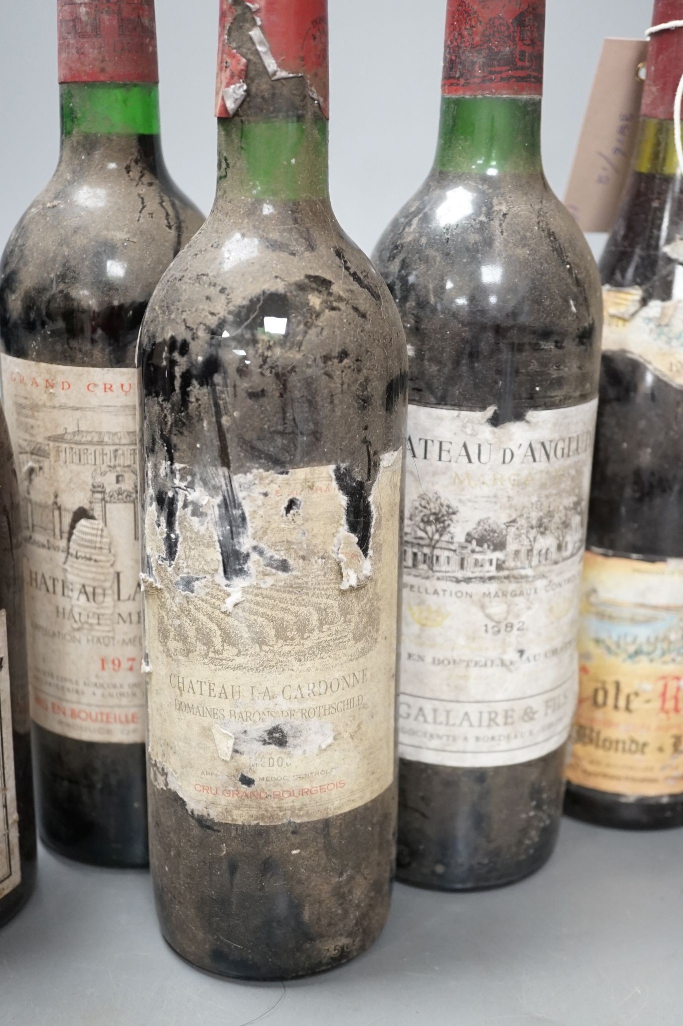 Six various bottles of red wine including two bottles of Château La Lagune 1976 etc.